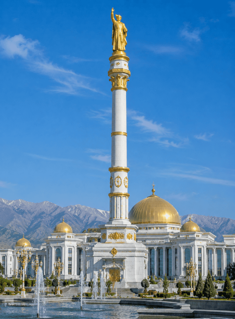 Iconic monument and mosque with golden domes in a scenic mountain backdrop, emphasizing cultural her.
